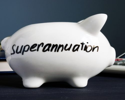Superannuation written on a white piggy bank.
